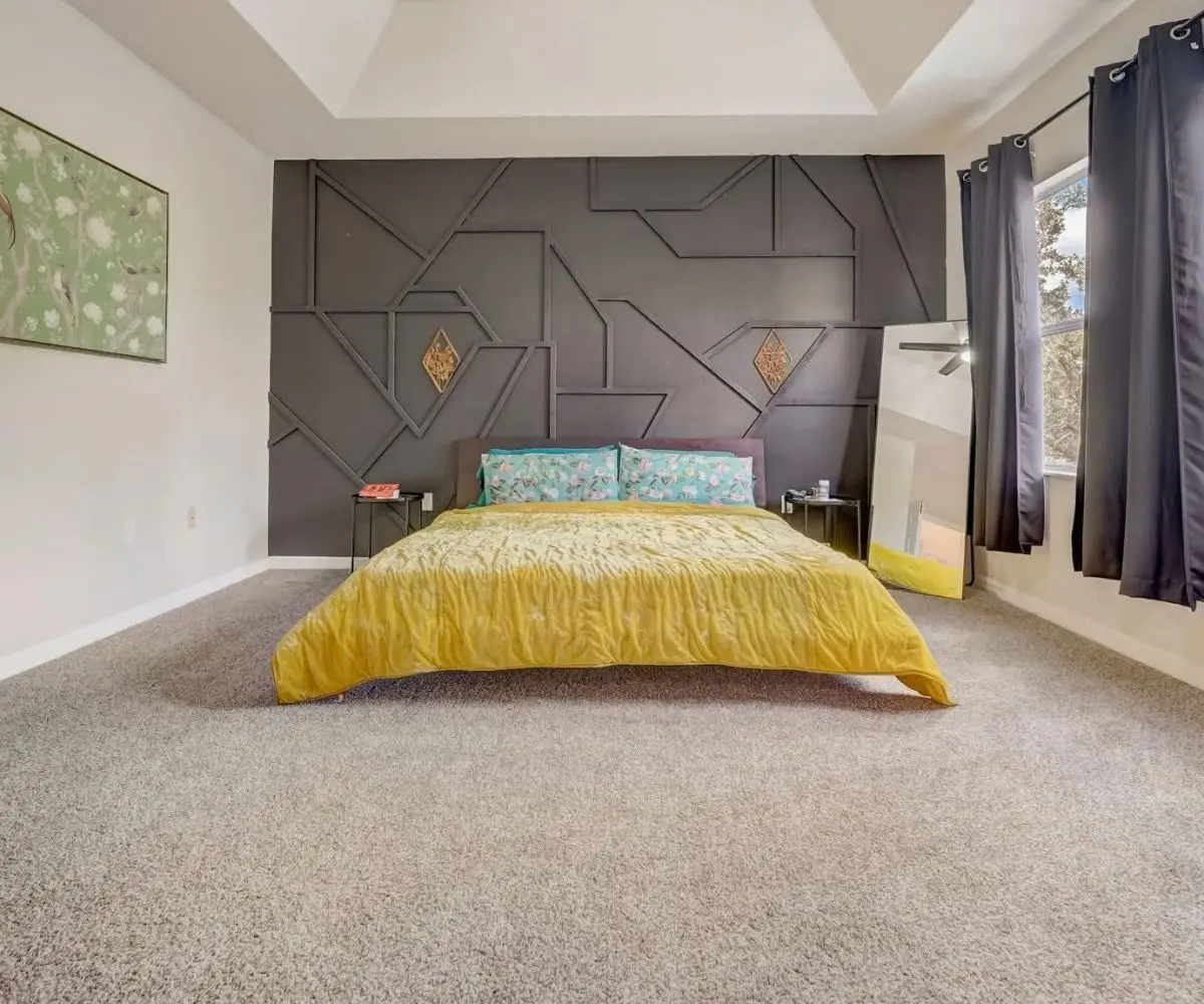 Finished geometric trim accent wall in a bedroom in Saint Augustine, Florida