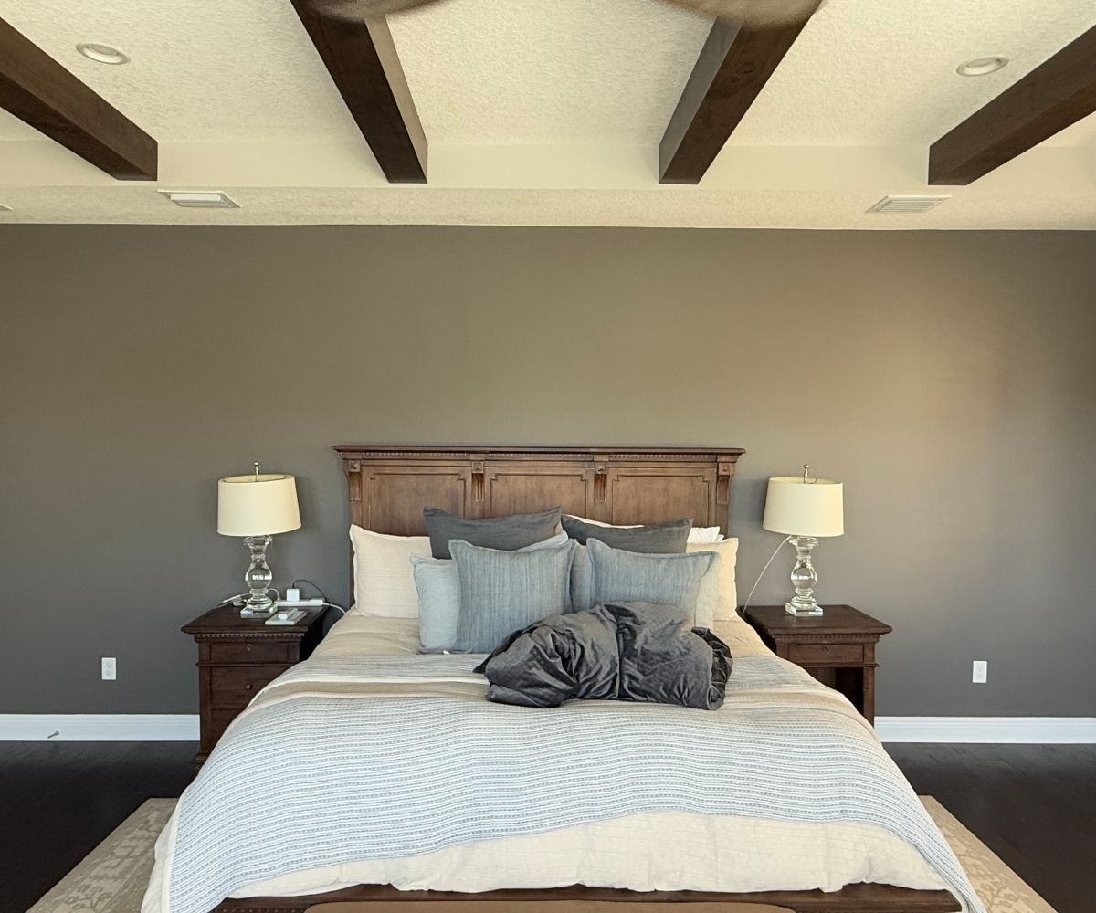 Painted bedroom accent wall with wood ceiling beams in Saint Augustine, Florida