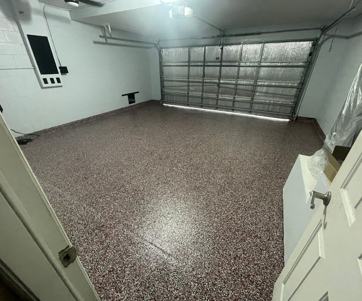 Finished maroon flake epoxy and polyaspartic garage floor in Saint Augustine, Florida