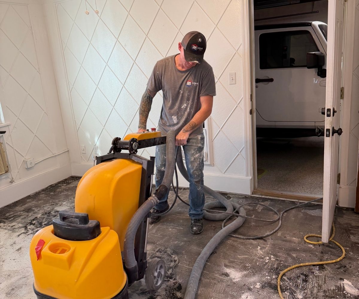 PD Home Pros crew diamond-grinding a concrete slab to prep it for coating in Saint Augustine, Florida