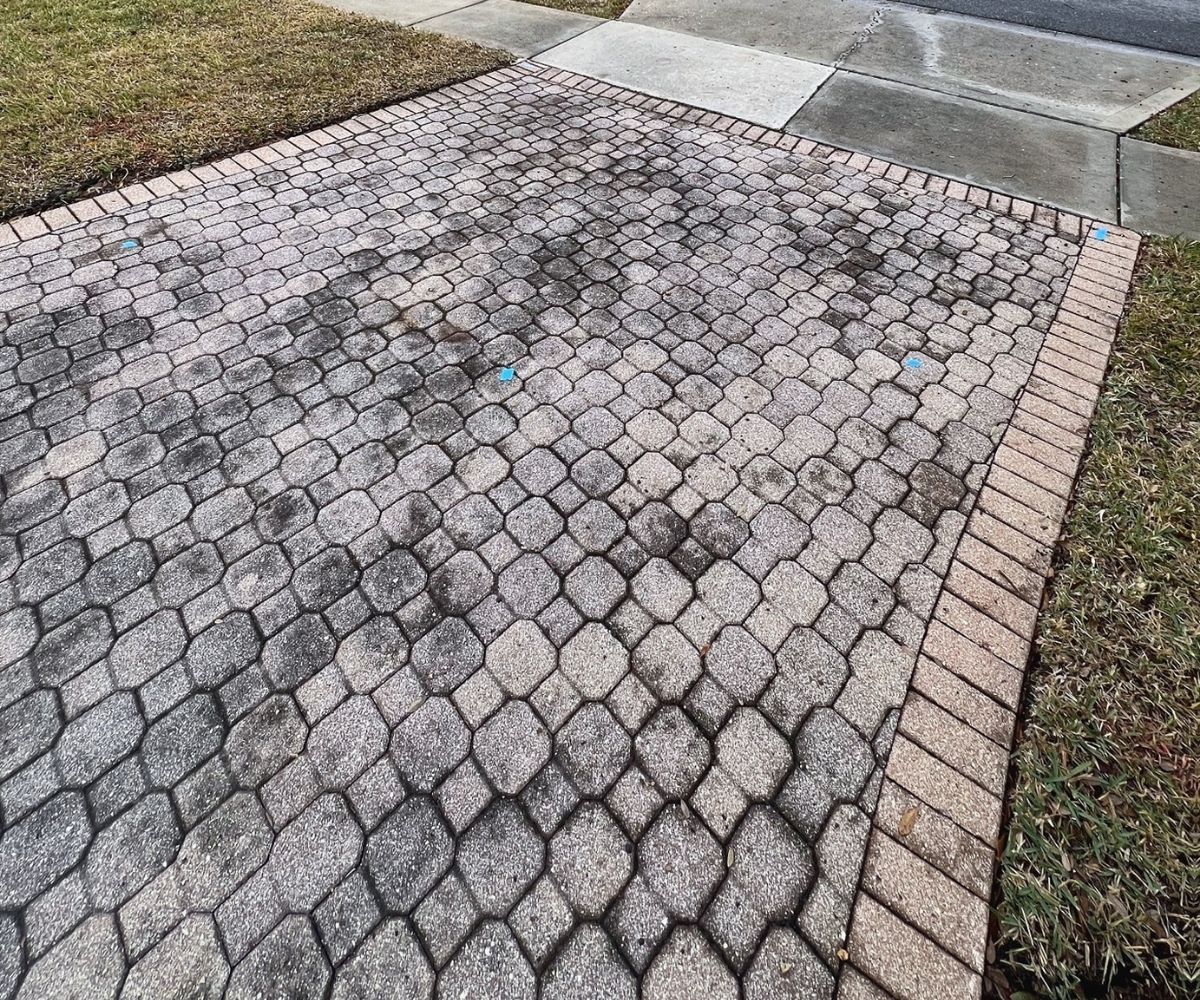 Stained octagon paver driveway before restoration in Saint Augustine, Florida