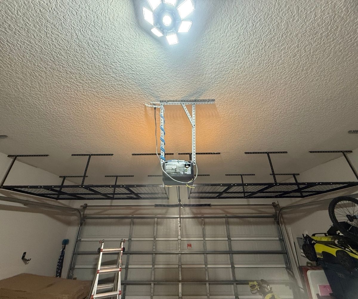 Overhead garage storage rack installed above a garage door in Saint Augustine, Florida