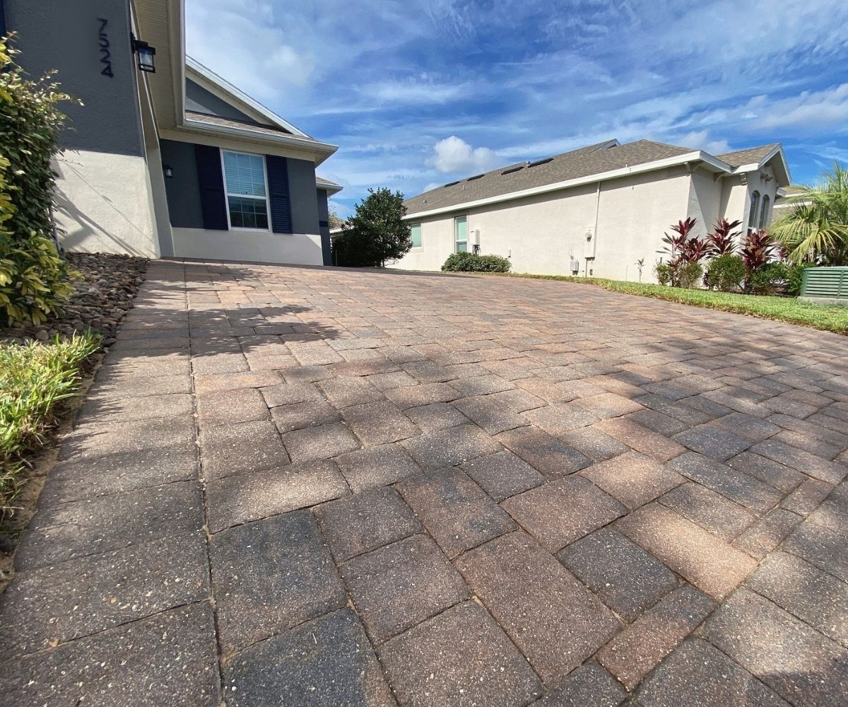 Same paver driveway after sealing, color restored, in Saint Augustine, Florida