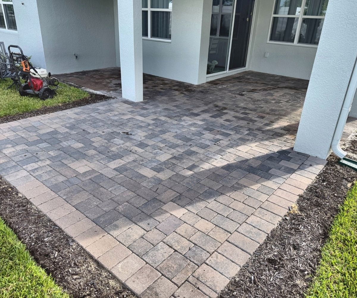 Dirty paver patio before pressure washing in Saint Augustine, Florida