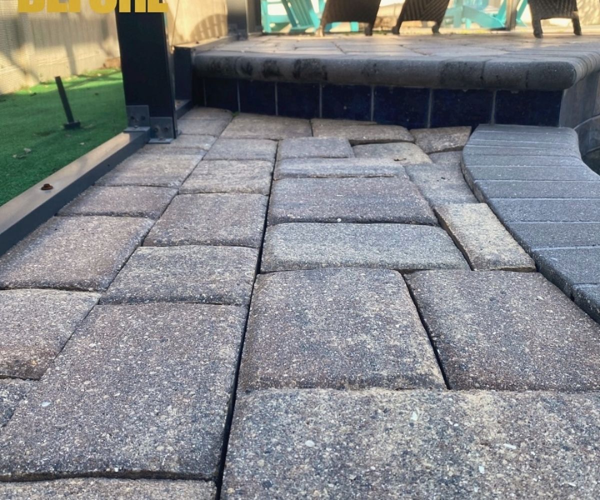 Sunken pavers at a pool step before repair in Saint Augustine, Florida